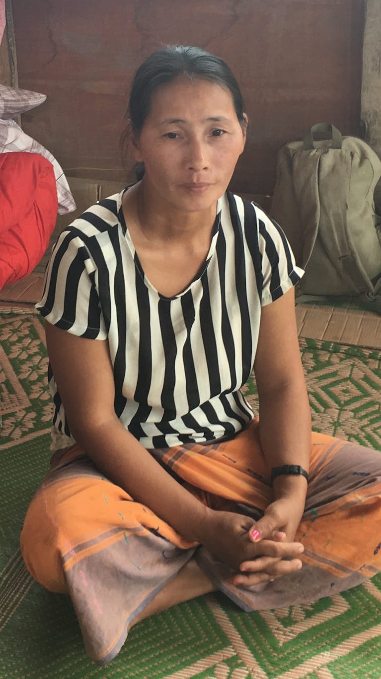 De 37-jarige Maji Hka Tawm vluchtte na beschietingen uit het Zai Awng vluchtelingekamp in Kachin staat, Myanmar. December 2016