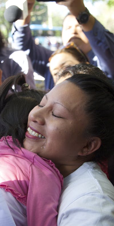 Teodora Vasquez hugs her family and friends shortly after being released from the women's Readaptation Center, in Ilopango, El Salvador on February 15, 2018, where she was serving a sentence since 2008, handed down under draconian anti-abortion laws after suffering a miscarriage.
