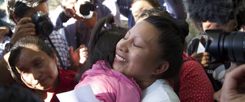 Teodora Vasquez hugs her family and friends shortly after being released from the women's Readaptation Center, in Ilopango, El Salvador on February 15, 2018, where she was serving a sentence since 2008, handed down under draconian anti-abortion laws after suffering a miscarriage.