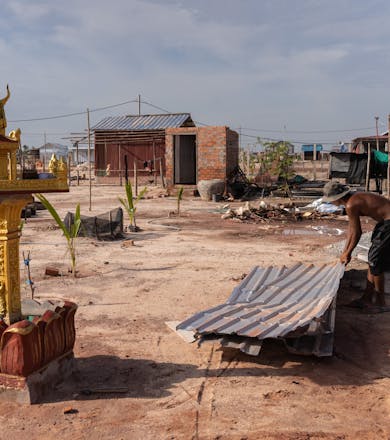 July 6, 2023 - Run Ta Ek, Siem Reap (Cambodia). A resident tries to repair part of the rooftop of his house after it was badly damaged by a violent storm the week prior.
